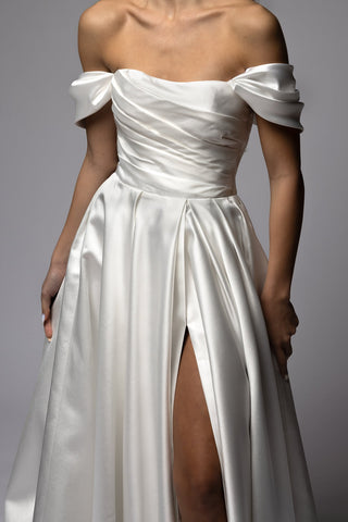 Draped off-shoulder Mikado sleeves on a wedding dress bodice
