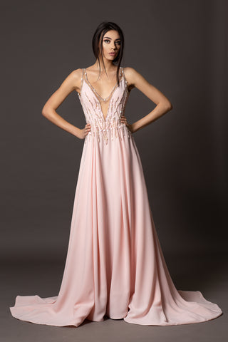 Blush pink evening gown with V-neckline, beaded bodice, open back and flowing A-line skirt.